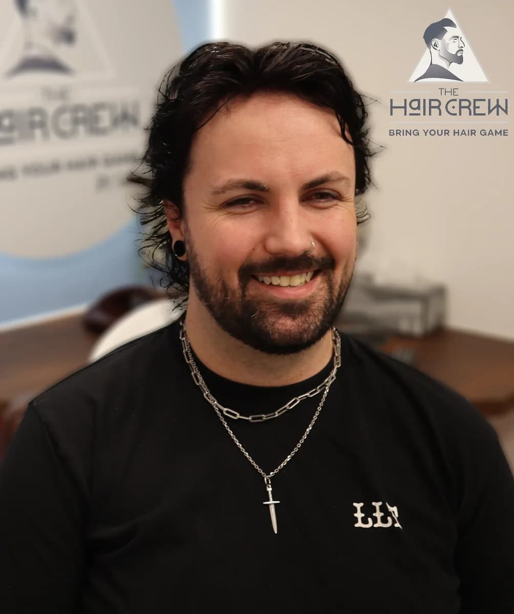 Smiling Hair Crew client showing his finished, naturally styled hair system
